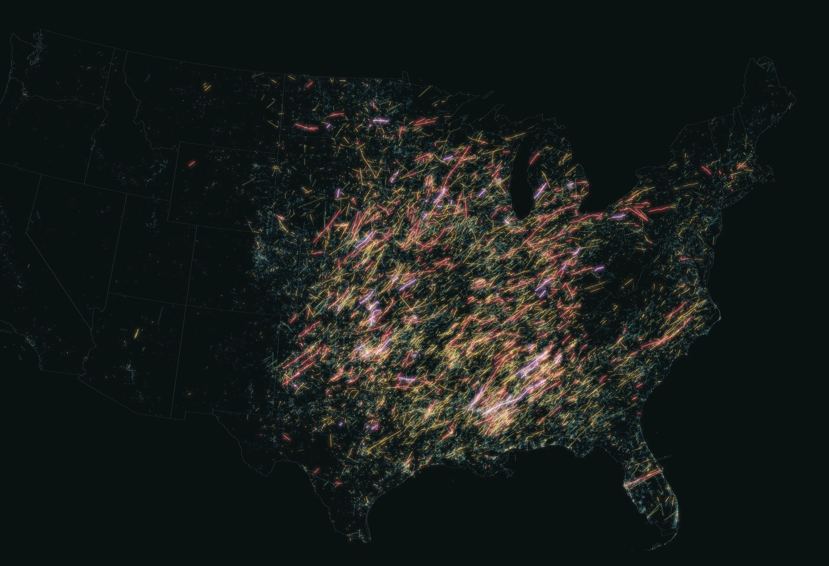 Map of every tornado track recorded in the lower 48 states since 1950, drawn as glowing lines coloured by rating. They pack densest across the central and southern Plains and the Deep South.